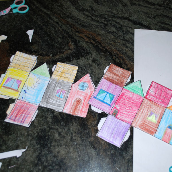 cutting out the triangular prism toy house